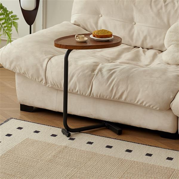 C-shaped side table pulled up to a sofa