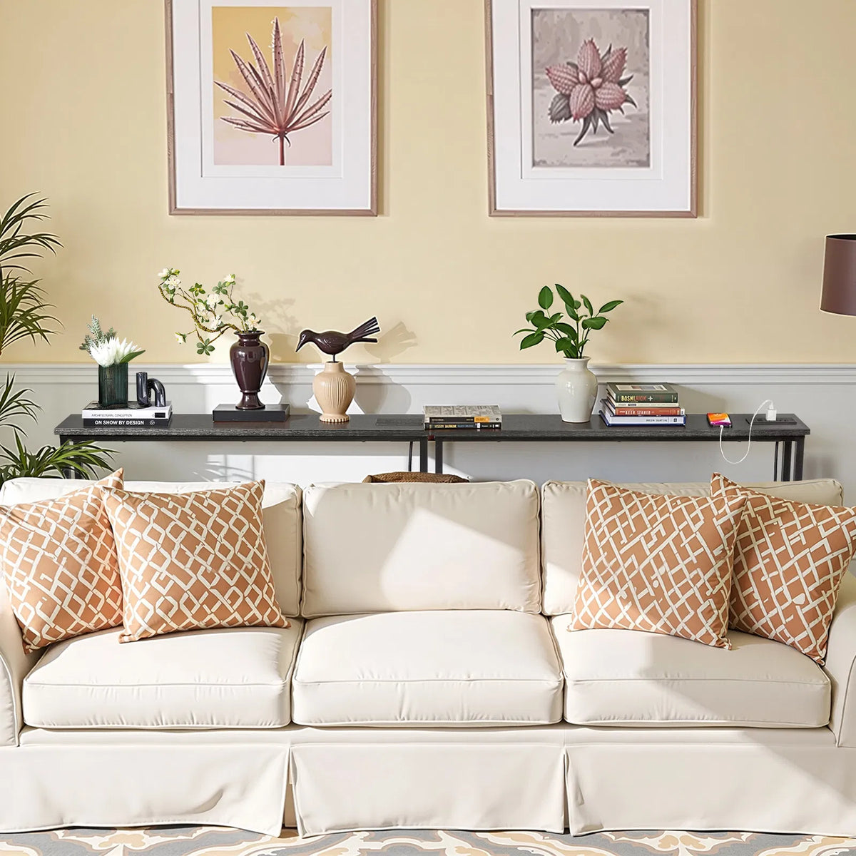 Narrow console table behind a sofa