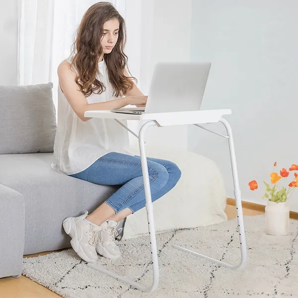 Tray table used as a laptop desk from the sofa