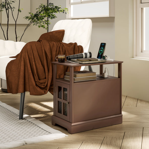 Narrow brown side table with charging station next to a chair