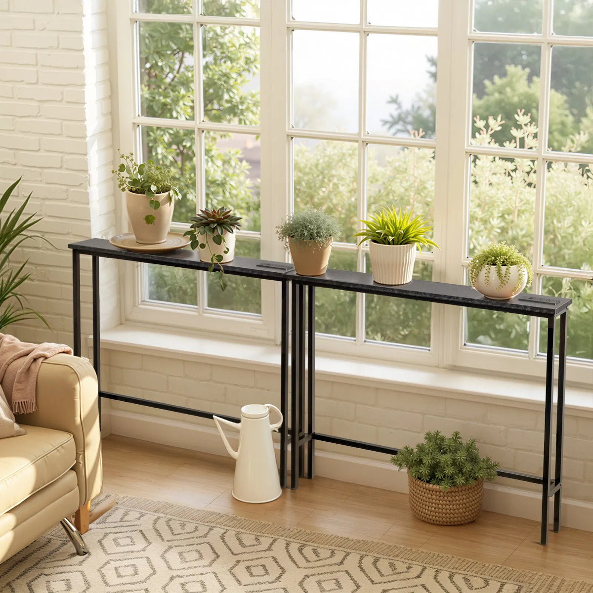 Narrow console tables along a window wall