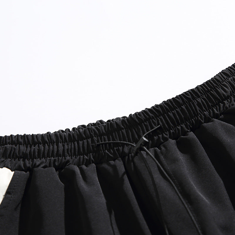 Elastic waistband and drawstring tie detail