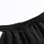 Elastic waistband and drawstring tie detail