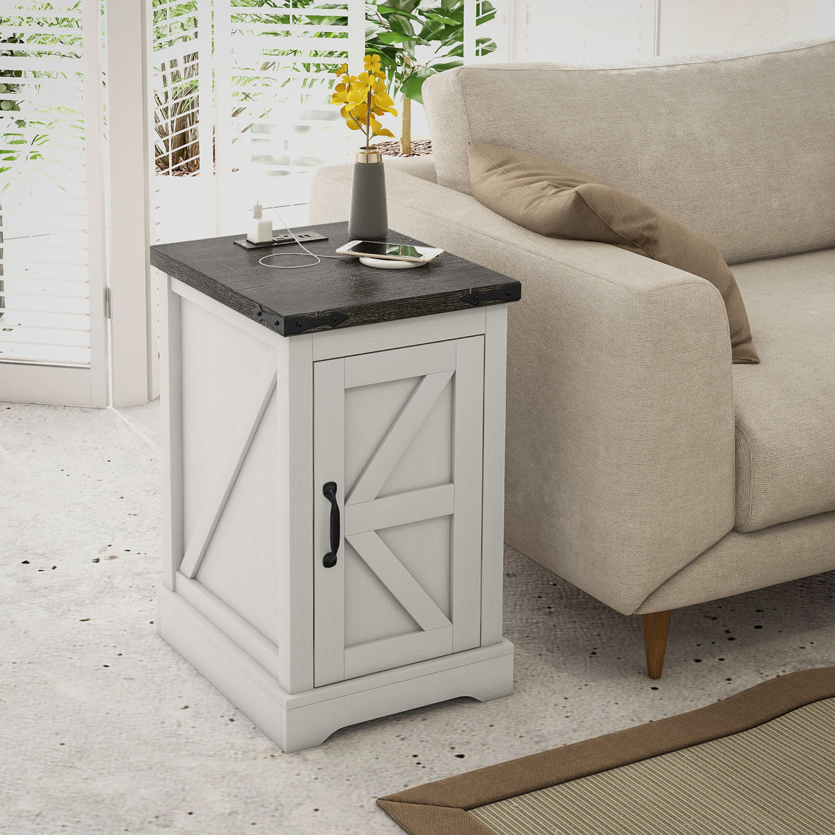 Distressed white farmhouse end table beside a sofa