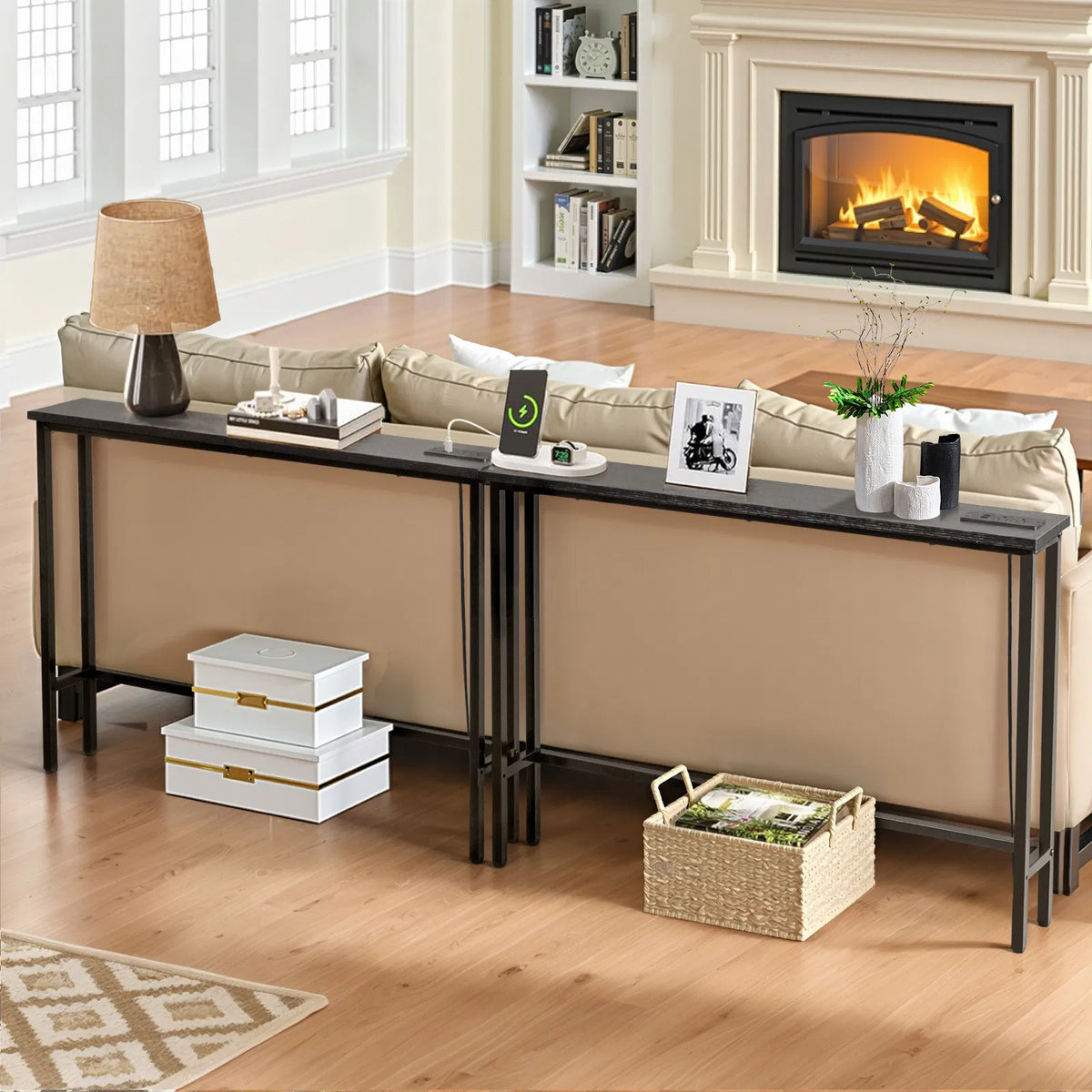 Two narrow black sofa tables behind a couch